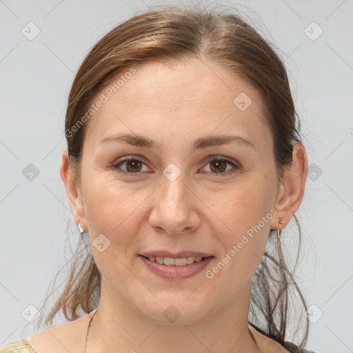 Joyful white adult female with medium  brown hair and brown eyes