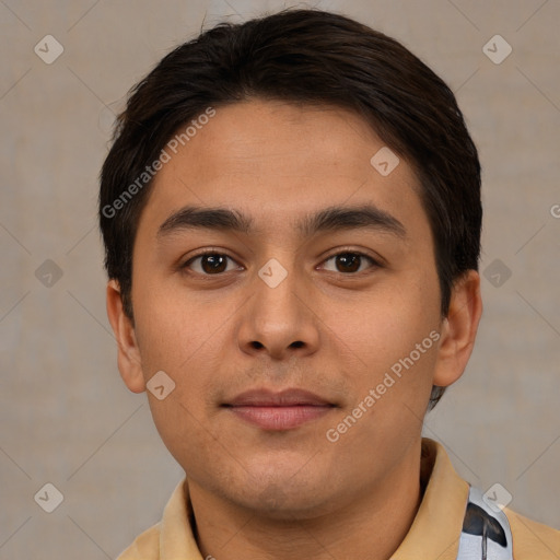 Joyful latino young-adult male with short  brown hair and brown eyes