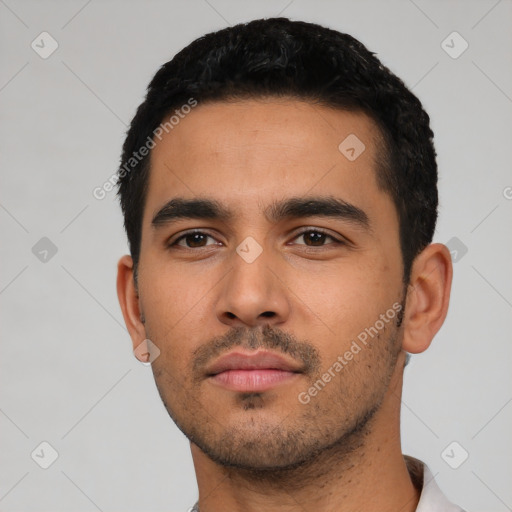 Neutral latino young-adult male with short  black hair and brown eyes