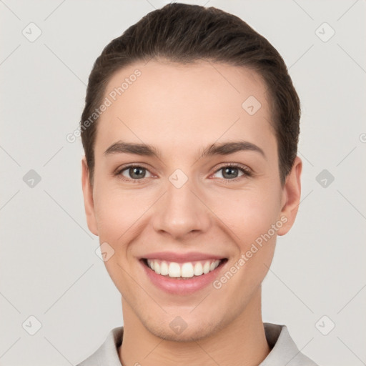 Joyful white young-adult female with short  brown hair and brown eyes