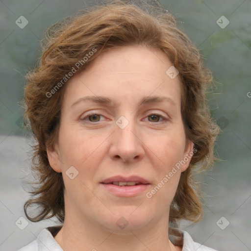 Joyful white adult female with medium  brown hair and green eyes