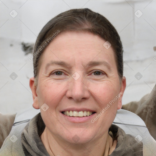 Joyful white adult female with short  brown hair and grey eyes