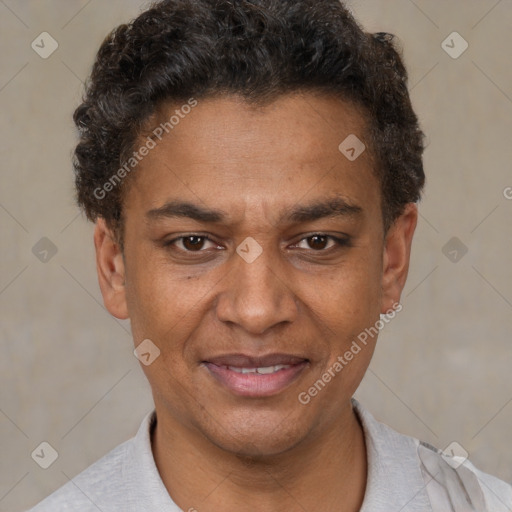 Joyful black young-adult male with short  brown hair and brown eyes