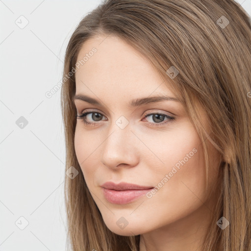 Neutral white young-adult female with long  brown hair and brown eyes