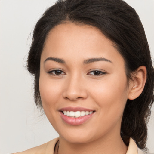 Joyful white young-adult female with long  brown hair and brown eyes