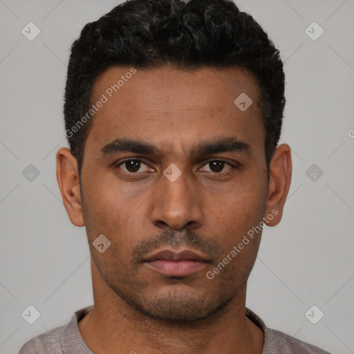 Neutral latino young-adult male with short  black hair and brown eyes