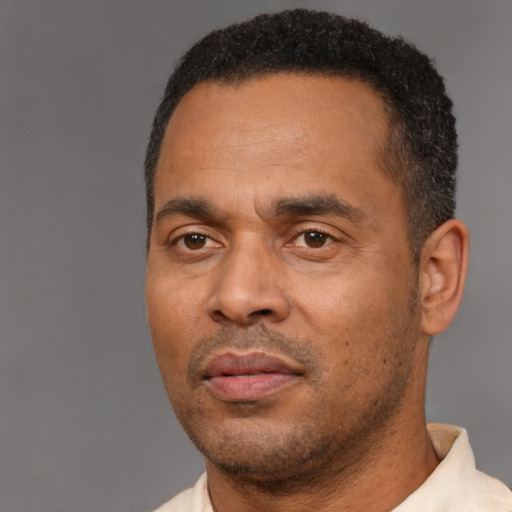 Neutral latino adult male with short  black hair and brown eyes