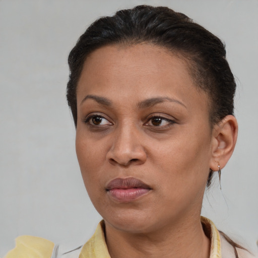 Neutral latino adult female with short  brown hair and brown eyes