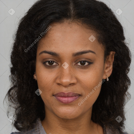 Joyful black young-adult female with long  brown hair and brown eyes