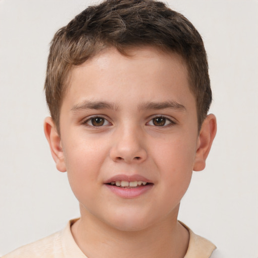 Joyful white child male with short  brown hair and brown eyes