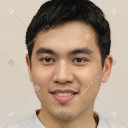 Joyful white young-adult male with short  black hair and brown eyes