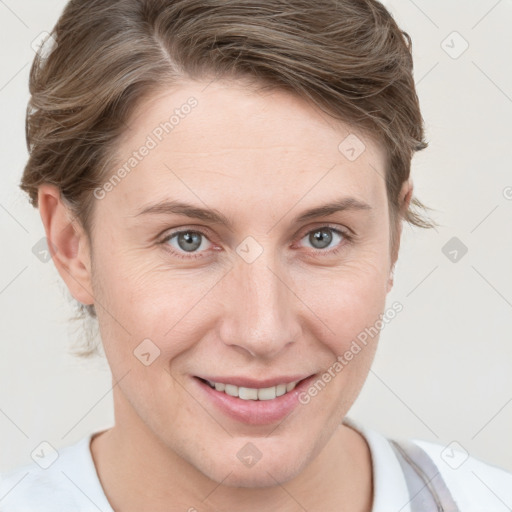 Joyful white young-adult female with short  brown hair and grey eyes