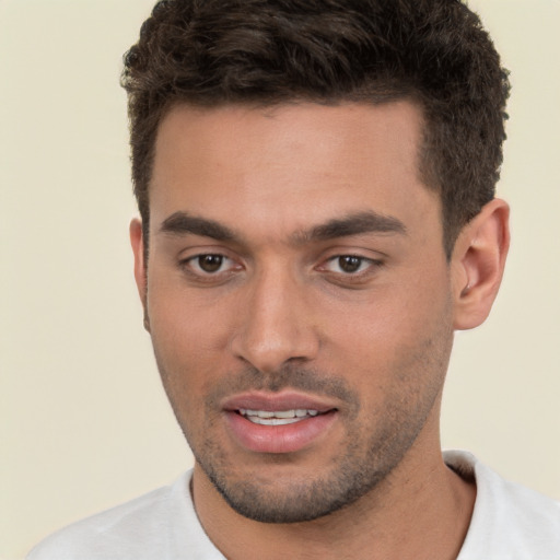 Joyful white young-adult male with short  brown hair and brown eyes