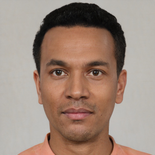 Neutral latino young-adult male with short  black hair and brown eyes
