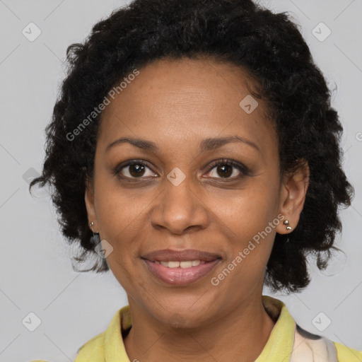 Joyful black adult female with short  brown hair and brown eyes