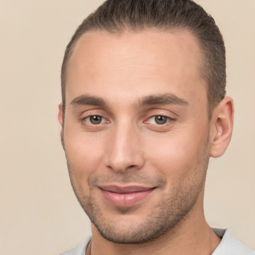 Joyful white young-adult male with short  brown hair and brown eyes