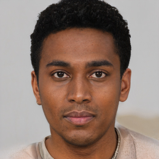 Neutral black young-adult male with short  black hair and brown eyes
