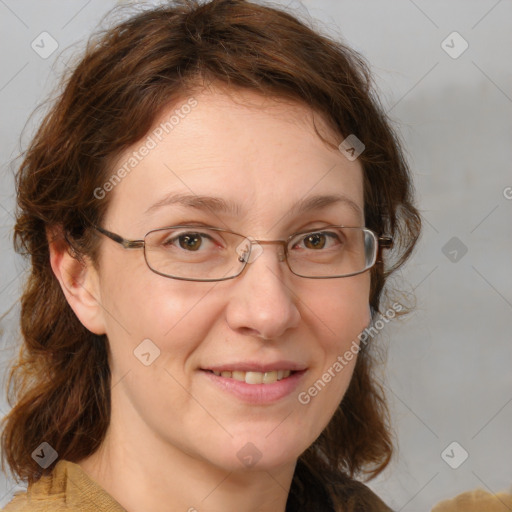 Joyful white adult female with medium  brown hair and brown eyes