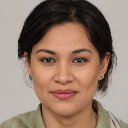 Joyful white adult female with medium  brown hair and brown eyes