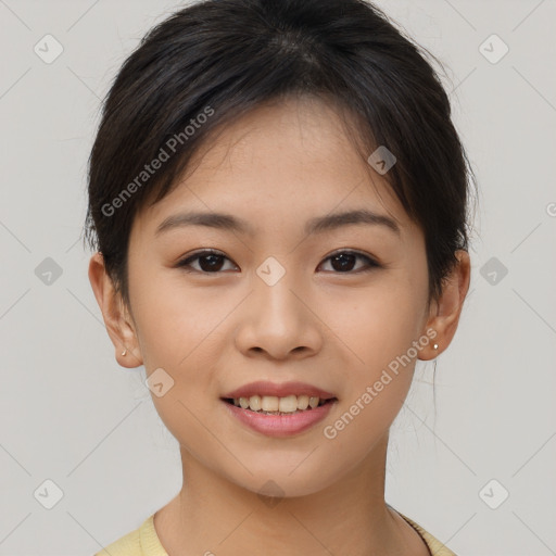 Joyful asian young-adult female with short  brown hair and brown eyes