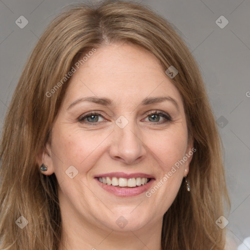 Joyful white adult female with long  brown hair and brown eyes