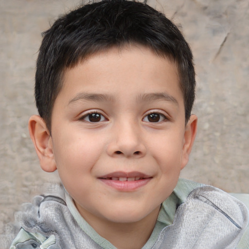 Joyful white child male with short  brown hair and brown eyes