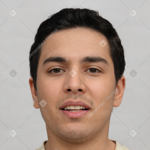 Joyful white young-adult male with short  black hair and brown eyes