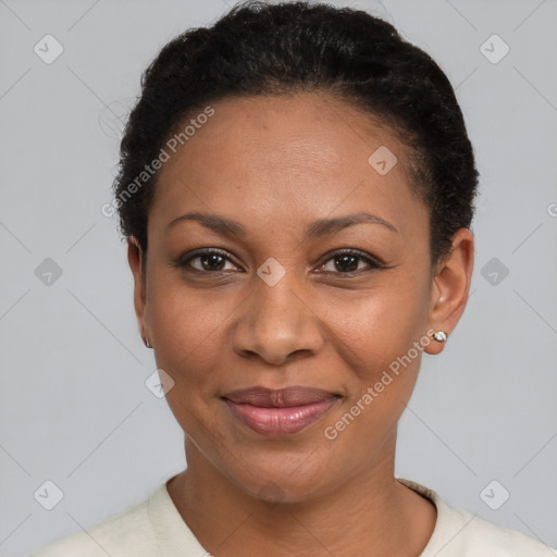 Joyful black adult female with short  black hair and brown eyes