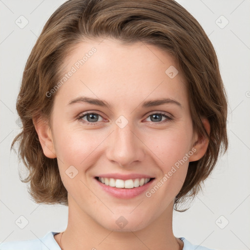 Joyful white young-adult female with medium  brown hair and green eyes