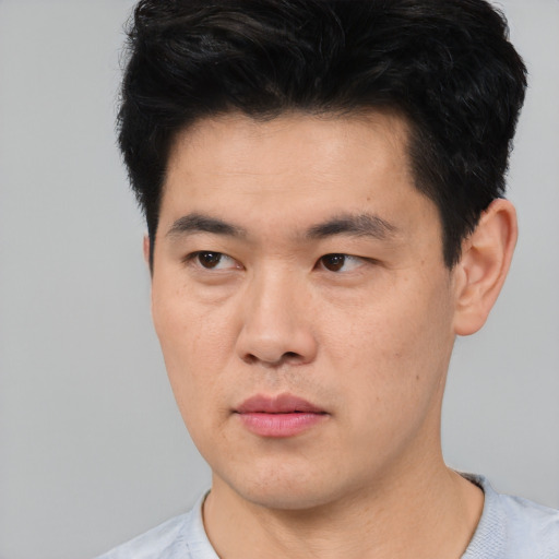 Neutral asian young-adult male with short  black hair and brown eyes