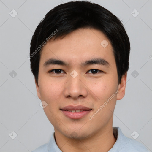 Joyful asian young-adult male with short  black hair and brown eyes