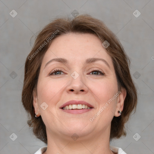 Joyful white adult female with medium  brown hair and brown eyes