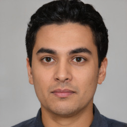 Neutral white young-adult male with short  black hair and brown eyes
