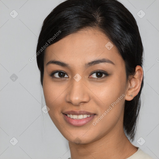 Joyful asian young-adult female with medium  black hair and brown eyes