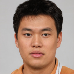 Neutral asian young-adult male with short  brown hair and brown eyes