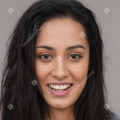 Joyful latino young-adult female with long  brown hair and brown eyes