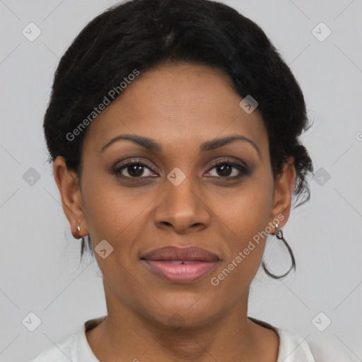 Joyful black young-adult female with short  black hair and brown eyes