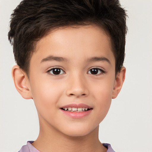 Joyful white child male with short  brown hair and brown eyes