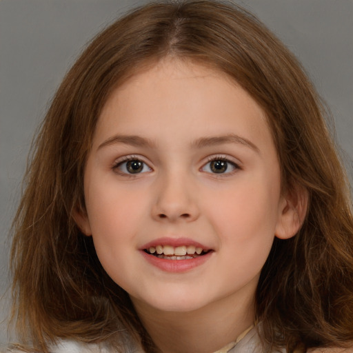 Joyful white child female with long  brown hair and brown eyes