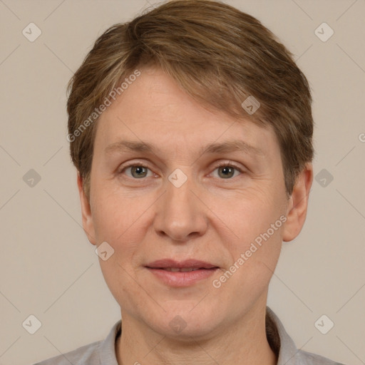 Joyful white adult male with short  brown hair and grey eyes