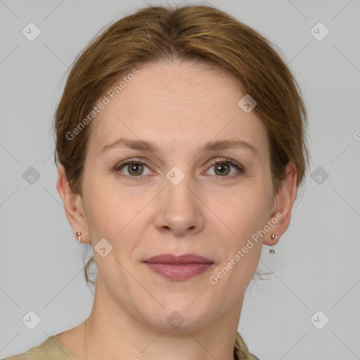 Joyful white adult female with medium  brown hair and grey eyes