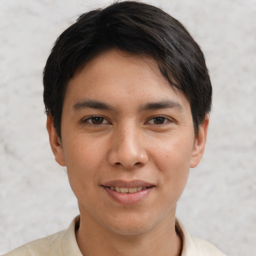 Joyful asian young-adult male with short  brown hair and brown eyes