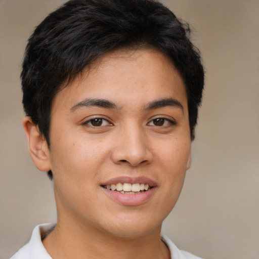 Joyful asian young-adult female with short  brown hair and brown eyes