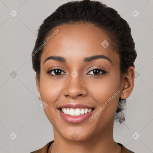 Joyful latino young-adult female with short  brown hair and brown eyes