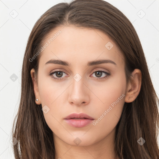 Neutral white young-adult female with long  brown hair and brown eyes