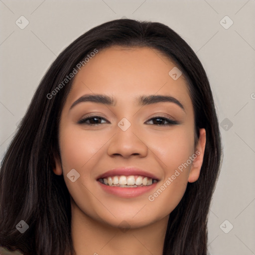 Joyful latino young-adult female with long  black hair and brown eyes