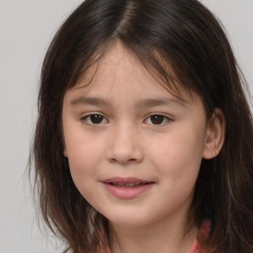 Joyful white child female with medium  brown hair and brown eyes