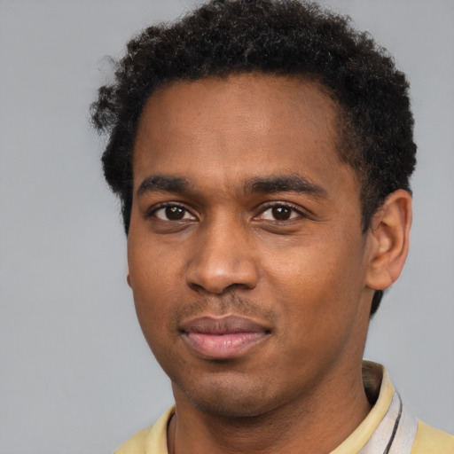 Neutral black young-adult male with short  brown hair and brown eyes