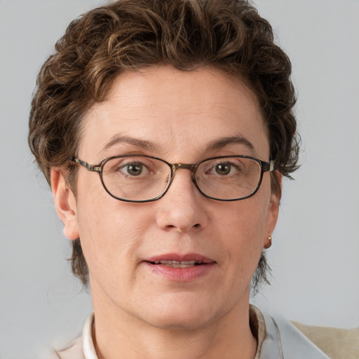 Joyful white adult female with short  brown hair and grey eyes