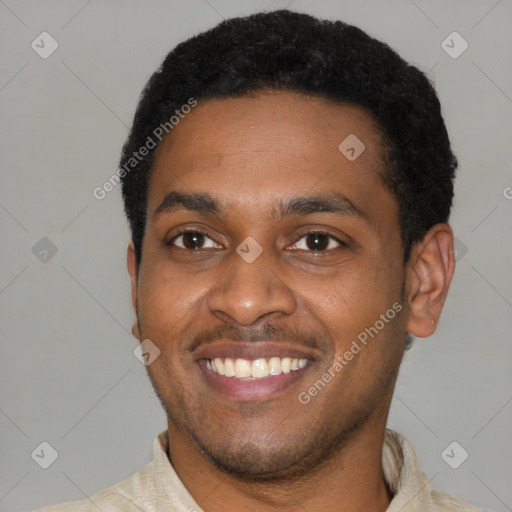 Joyful latino young-adult male with short  brown hair and brown eyes